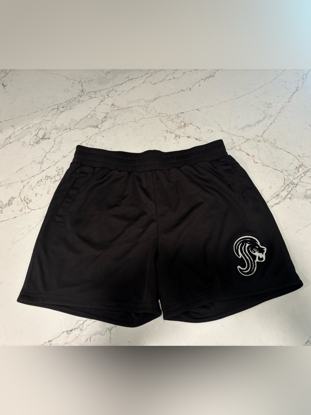 Streignth Black Athletic Shorts with White Lion Graphic